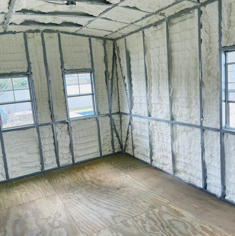 Closed-cell spray foam insulation applied to wall cavities in a residential project in Brownfield